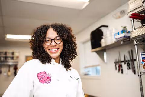 Chef Lindsay smiling in her commercial kitchen